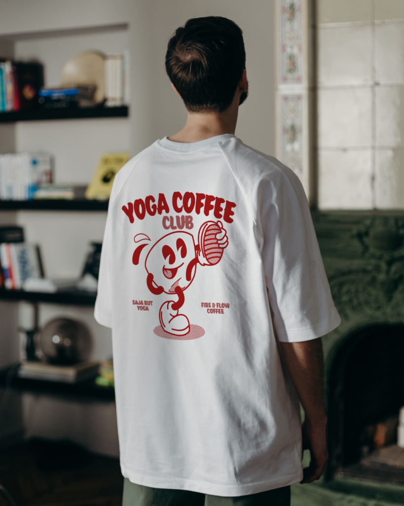 Man wearing Yoga Coffee Club tee with Yoga Coffee Club graphic on the back
